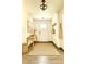 Charming entryway featuring a decorative chandelier, stylish console table, and warm decor at 2903 Hardin Dr, Henderson, NV 89074