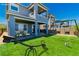 New two-story home with a manicured backyard and outdoor swing at 312 Wind Poppy St, Las Vegas, NV 89138