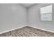 Empty bedroom with wood floor and a single window at 312 Wind Poppy St, Las Vegas, NV 89138