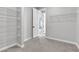 Walk in closet features white wire shelving and neutral carpeting at 312 Wind Poppy St, Las Vegas, NV 89138