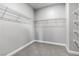 This walk-in closet features white wire shelving and neutral carpeting at 312 Wind Poppy St, Las Vegas, NV 89138
