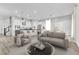 Open-concept living room with modern decor and abundant natural light at 312 Wind Poppy St, Las Vegas, NV 89138