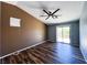 Spacious bedroom with a modern ceiling fan, stylish flooring, and sliding glass doors to the outside at 3412 Catherine Mermet Ave, North Las Vegas, NV 89081