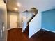 Inviting foyer featuring wood floors, staircase, front door, and neutral paint at 3412 Catherine Mermet Ave, North Las Vegas, NV 89081