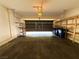 Two-car garage with closed door showing available storage and organization at 3412 Catherine Mermet Ave, North Las Vegas, NV 89081