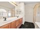 Bathroom featuring double sinks, a glass-enclosed shower, and stylish finishes at 3597 Cherbourg Ave, Las Vegas, NV 89141