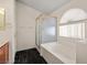 Bright bathroom featuring a shower with gold trim, garden tub, and half moon window for natural lighting at 3597 Cherbourg Ave, Las Vegas, NV 89141