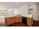 Functional kitchen with a breakfast bar, stainless steel sink, and modern dishwasher at 3597 Cherbourg Ave, Las Vegas, NV 89141