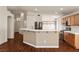 Open kitchen offers a breakfast bar, modern appliances, and ample counter space at 3597 Cherbourg Ave, Las Vegas, NV 89141