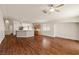 Expansive living space features wood flooring, seamlessly flowing into the kitchen area at 3597 Cherbourg Ave, Las Vegas, NV 89141