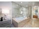 Bright bathroom featuring a soaking tub, glass enclosed shower, and luxurious finishes at 3722 Las Vegas Blvd # 2512 E, Las Vegas, NV 89158