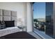 Bedroom offering stunning city views through expansive glass windows at 3722 Las Vegas Blvd # 2512 E, Las Vegas, NV 89158