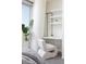Bedroom with stylish accent chair and built-in desk and shelves, offering functionality and a touch of elegance at 3722 Las Vegas Blvd # 2512 E, Las Vegas, NV 89158