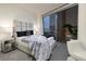 Bedroom featuring plush bedding, city views, and ambient lighting at 3722 Las Vegas Blvd # 2512 E, Las Vegas, NV 89158