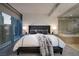 Bedroom featuring a large bed, city views, ensuite bath and modern decor at 3722 Las Vegas Blvd # 2512 E, Las Vegas, NV 89158