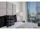 Close up view of city view bedroom with plush bedding, soft lighting, and great views at 3722 Las Vegas Blvd # 2512 E, Las Vegas, NV 89158
