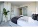 Modern bedroom featuring a plush bed, neutral tones, and a stylish plant accent for a serene atmosphere at 3722 Las Vegas Blvd # 2512 E, Las Vegas, NV 89158