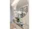 Close-up of hallway decor featuring a round mirror, fresh flowers, and stylish accents at 3722 Las Vegas Blvd # 2512 E, Las Vegas, NV 89158