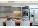 Modern kitchen with stainless appliances, sleek cabinetry, and an adjacent dining area at 3722 Las Vegas Blvd # 2512 E, Las Vegas, NV 89158