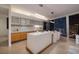 Well-equipped kitchen with stainless steel appliances, island, and dining area with city views at 3722 Las Vegas Blvd # 2512 E, Las Vegas, NV 89158