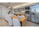 Modern kitchen with stainless steel appliances, dining table, and elegant lighting at 3722 Las Vegas Blvd # 2512 E, Las Vegas, NV 89158