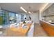 Open floor plan with modern kitchen, dining area, and living room with city views at 3722 Las Vegas Blvd # 2512 E, Las Vegas, NV 89158