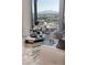 Sophisticated living room with mirrored tables, plush seating, and stunning city views at 3722 Las Vegas Blvd # 2512 E, Las Vegas, NV 89158