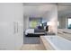 Open ensuite bathroom featuring a luxurious soaking tub and access to the primary bedroom at 3722 Las Vegas Blvd # 2512 E, Las Vegas, NV 89158