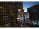 Nighttime cityscape featuring modern architecture and bright lights reflecting off adjacent buildings at 3722 Las Vegas Blvd # 2512 E, Las Vegas, NV 89158