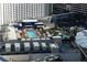 View of a rooftop pool with lounge chairs, cabanas, and palm trees creating an upscale resort atmosphere at 3722 Las Vegas Blvd # 2512 E, Las Vegas, NV 89158