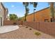 Low-maintenance backyard featuring desert landscaping, a concrete patio and brick walls for privacy at 390 Clarence House Ave # 1, North Las Vegas, NV 89032