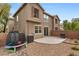 Backyard area includes a trampoline, patio, and low maintenance desert landscaping at 390 Clarence House Ave # 1, North Las Vegas, NV 89032