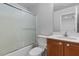 Well-lit bathroom featuring a shower-tub combo, vanity with sink, and standard toilet at 390 Clarence House Ave # 1, North Las Vegas, NV 89032