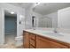 Bathroom showcasing a double sink vanity and separate shower and toilet rooms at 390 Clarence House Ave # 1, North Las Vegas, NV 89032