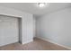 Spare bedroom space with closet and doorway to an adjacent room at 390 Clarence House Ave # 1, North Las Vegas, NV 89032