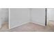 Neutral bedroom with carpeted floors, an open closet area, and natural light from hallway at 390 Clarence House Ave # 1, North Las Vegas, NV 89032