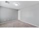 Neutral bedroom showcasing gray walls and carpeted floors, ready for personalization at 390 Clarence House Ave # 1, North Las Vegas, NV 89032