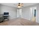 Comfortable bedroom featuring a ceiling fan and access to an adjacent bathroom at 390 Clarence House Ave # 1, North Las Vegas, NV 89032