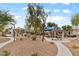 Community park featuring a gazebo, playground, and lush landscaping at 390 Clarence House Ave # 1, North Las Vegas, NV 89032
