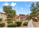 A peaceful gazebo in a well-maintained community courtyard with mature trees and bushes at 390 Clarence House Ave # 1, North Las Vegas, NV 89032