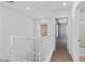 Upper hallway offering access to bathroom and bedroom areas with carpeted floor at 390 Clarence House Ave # 1, North Las Vegas, NV 89032