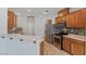 Modern kitchen boasts stainless appliances, a mosaic backsplash, and ample counter space at 390 Clarence House Ave # 1, North Las Vegas, NV 89032