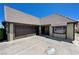 Exterior view showcasing a home with a tile roof, a garage, and an inviting front entrance at 3928 Edgemoor Way, Las Vegas, NV 89121