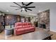 Inviting living room with a stone fireplace, stylish decor, and hardwood floors at 3928 Edgemoor Way, Las Vegas, NV 89121