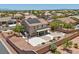 Aerial view displays the backyard with a basketball court, patio, and desert landscaping in a residential neighborhood at 4021 Mountain Trek St, Las Vegas, NV 89129
