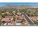 Spacious suburban neighborhood featuring desert landscaping with scenic mountain views in the background at 4021 Mountain Trek St, Las Vegas, NV 89129