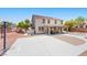 Large backyard features a basketball court, patio, shed, desert landscaping, and views of the two-story home at 4021 Mountain Trek St, Las Vegas, NV 89129