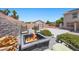 Cozy backyard fire pit area with seating, basketball court and desert landscape in a spacious outdoor setting at 4021 Mountain Trek St, Las Vegas, NV 89129