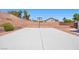 Spacious backyard boasts a basketball court, desert landscaping, and is perfect for outdoor activities and entertaining at 4021 Mountain Trek St, Las Vegas, NV 89129