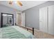 Comfortable bedroom featuring a closet, a ceiling fan, and neutral-toned carpet at 4021 Mountain Trek St, Las Vegas, NV 89129